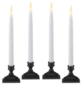 612 Vermont antique bronze LED taper candles grouped for a classic window display.