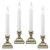 612 Vermont window candle pewter pack-4 on sill with inviting exterior glow.