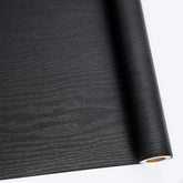 Abyssaly Black Wood Wallpaper roll with authentic grain for durable surface upgrades.