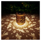AITENISEN dragonfly lantern hanging glows warmly on a patio.