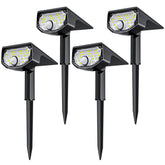 AloftSun pack of solar motion sensor lights illuminating a yard at night.