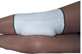 Alpha Medical knee pad worn by a side sleeper for gentle knee support.