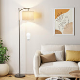 Ambimall 60-inch floor lamp with grey shade and black pole lights a modern living room.