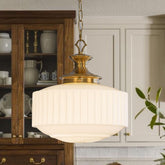 Aomuo vintage brass milk glass pendant shade brightens dining spaces.