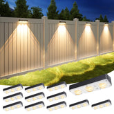 APONUO solar fence light glows softly along an outdoor wall