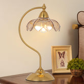 Artmooy amber flower shade table lamp provides warm, glare-free light for nightstands.