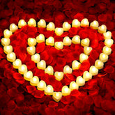 Audab rose petals and candles set packaging, ready-to-use romantic decor kit.
