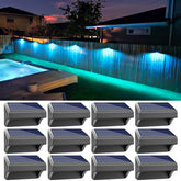 Aulanto 12 pack solar fence lights illuminate outdoor pathways with a downward glow