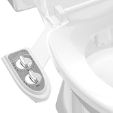 Aünsffer bidet attachment delivers frontal wash on a grey toilet for refreshed cleansing.