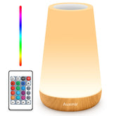Auxmir LED night light with top touch control for quick adjustments.