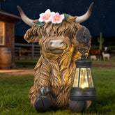 Ayadon Solar Highland Cow garden statue with LED lights adds warm nighttime ambiance.