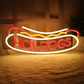 Balanar HOT DOGS neon sign on wall inviting customers into the storefront.