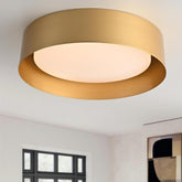 Bargeni flush mount light with polished gold finish enhances entryways and living spaces.