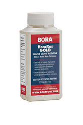 BORA HoneRite Gold bottle being poured, revealing rust-inhibiting honing solution.