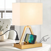 Briever touch-control table lamp in gold, front view showcasing the sturdy base.