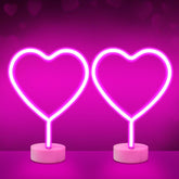 BRIGHTDECK pink heart neon sign closeup with soft ambient glow.