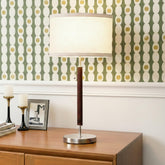 Brightech Carter bedside lamp with walnut finish delivers warm ambient lighting for bedrooms.