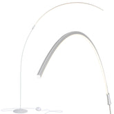 Brightech Sparq Arc floor lamp arches over a desk providing focused task lighting