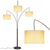 Brightech Trilage Arc lamp with three shades for layered room illumination.