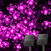 Brightown cherry blossom solar lights illuminate a garden setup with 52 feet of glow