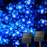 Brightown cherry blossom solar string lights illuminate outdoor spaces with blue blossoms