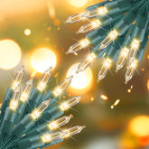 Brightown mini lights emit soft warm white light on green wire for cozy indoor decor