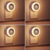 Briignite motion sensor night light plugged into wall outlet with warm glow