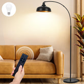 Brilvibera arch floor lamp arching over couch with warm, dimmable light for cozy evenings