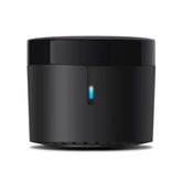 BroadLink RM4 Mini on table enables IR control for TV and AC.