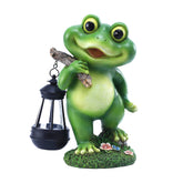 CFFOWNUG outdoor frog garden decor with LED lantern lighting up a patio at night