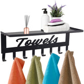 ChezMax towel rack with shelf in bathroom adds surface space for toiletries.