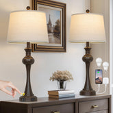 Cinyirong touch table lamps set of two with brown bases and beige shades provide ambient bedroom lighting.