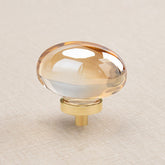 CLCTK champagne crystal knob oval front enhances cabinet aesthetics with shimmering glass.