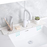Cnbnd stone sink mat around faucet catches drips and keeps counters dry.