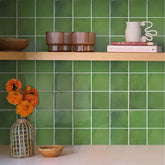 Commomy 12x12 inch peel-stick tiles with a 3D pattern for a striking kitchen backsplash.