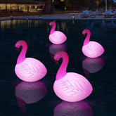 Cootway solar flamingo floating light glows softly to create poolside ambience.