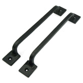 Craftsman Road black cast iron pull handle on cabinet, rugged farmhouse hardware for durable daily use.