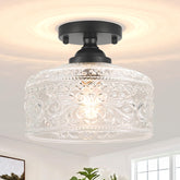 Daunton small semi-flush mount with glass shade for warm hallway ambience.