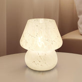 Dawnwake mushroom table lamp with hand-blown glass shade for elegant bedside lighting.