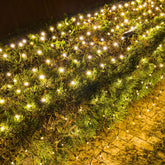 Dazzle Bright Christmas Net Lights showcase 360 LEDs on a green wire for seamless tree or shrub illumination.