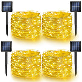 Dazzle Bright outdoor solar string lights on a yard showing warm white glow