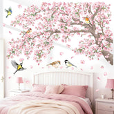 DecalMile cherry blossom tree branch wall sticker adds delicate pink florals to a nursery