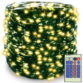 Decute 500LED lights on a tree with green wire for festive warmth.