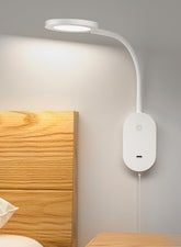 Deeloop wall-mounted reading light with USB output for convenient bedside charging.