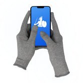 DefenderShield EMF protection gloves on hand during device use
