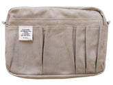 Delfonics Inner CarryingM light gray front pocket for quick access and organized storage.