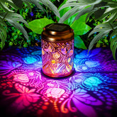 Dellicasi butterfly solar lantern in the garden creates a warm glow.