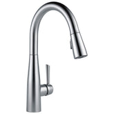 Delta Essa pull-down kitchen faucet in Arctic Stainless offering flexible reach at the sink