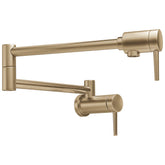 Delta pot filler wall mount with brushed gold finish for easy large-pot filling.