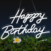 Dengduoduo Happy Birthday neon sign on wall creates a vibrant birthday backdrop.